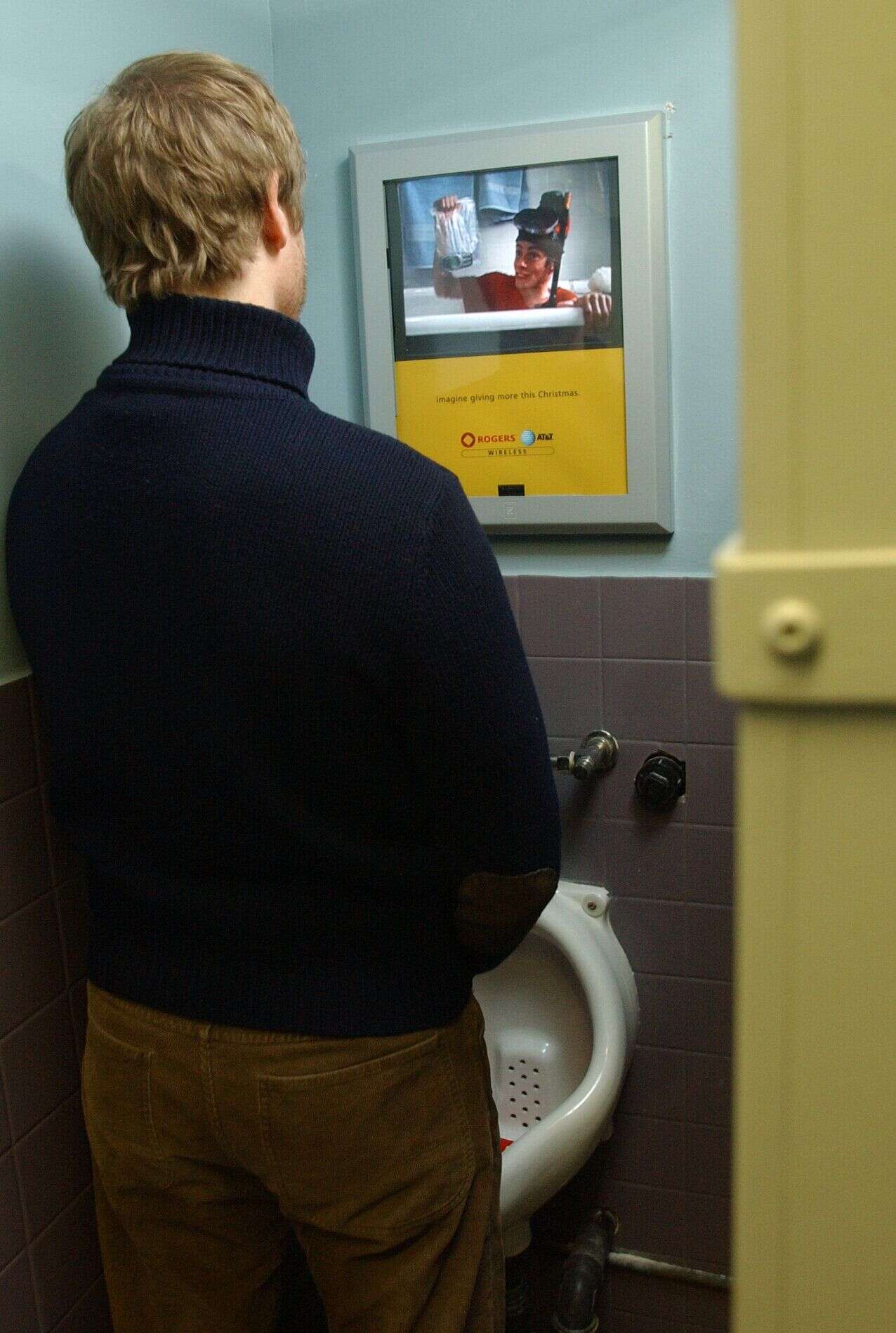 Bar One now features the next wave of above the urinal advertising for captive audiences. (Photo by Lucas Oleniuk/Toronto Star via Getty Images)