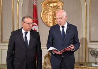 Le président tunisien Kais Saied (D) avec le nouveau ministre de l'Intérieur Ridha Gharsalloui (G) au palais présidentiel de Tunis le 29 juillet. (Photo by Tunisian Presidency / Handout/Anadolu Agency via Getty Images)