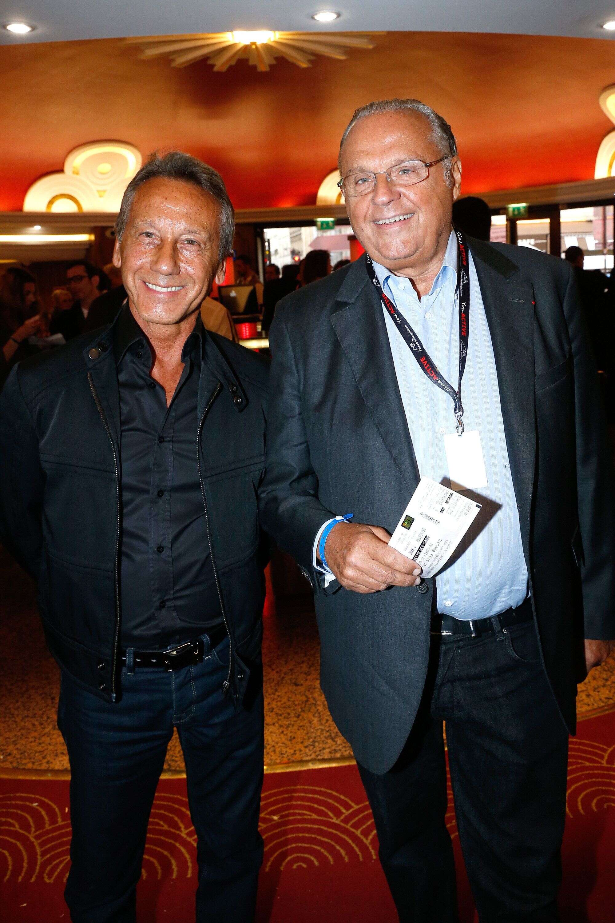 Gérard Louvin, à droite, et son mari Daniel Moyne sont visés par des plaintes pour viol et complicité de viol sur mineur par le neveu du producteur, Olivier A. (photo prise en mai 2014 à Paris).