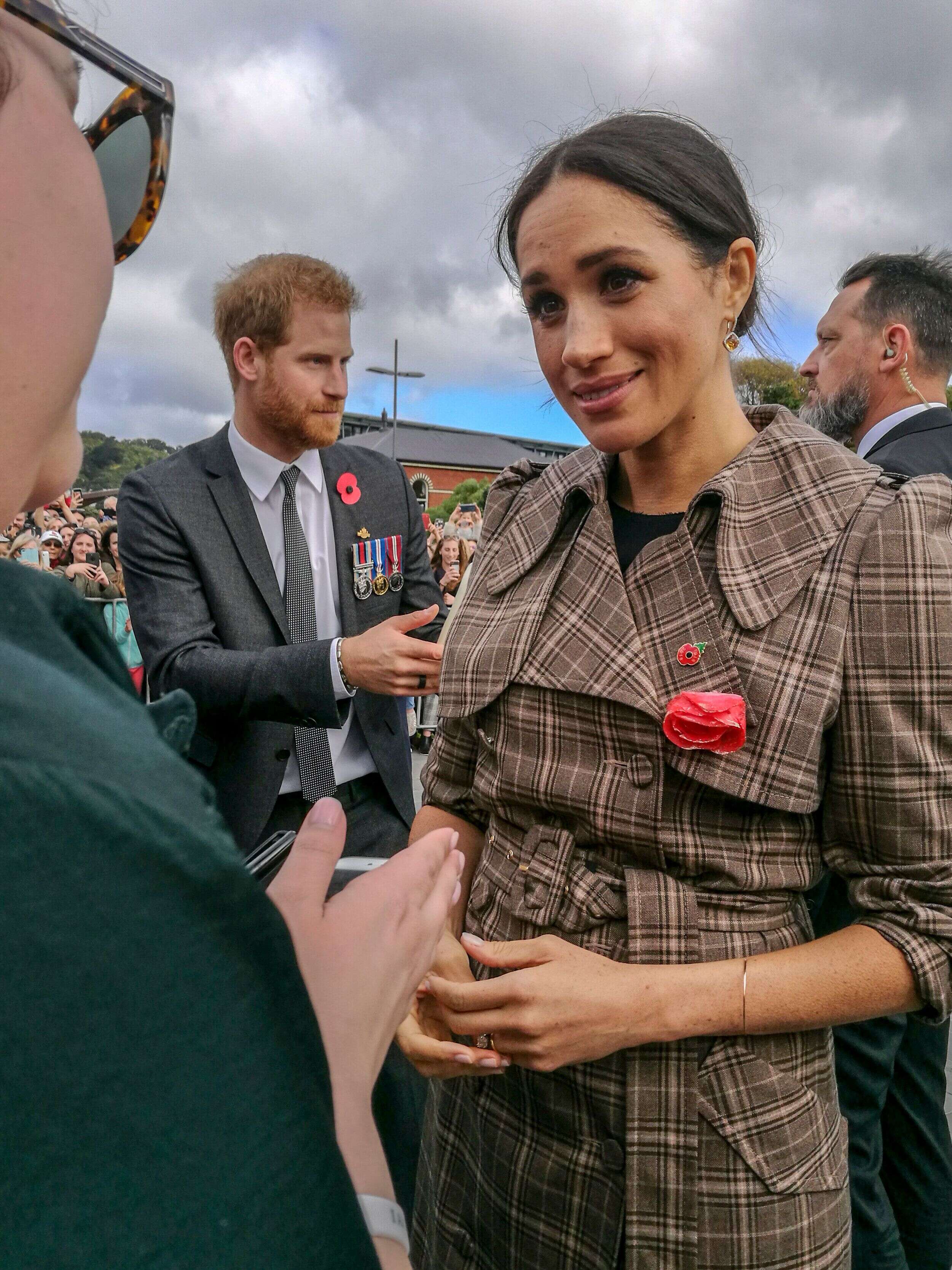 Wellington, New Zealand - October 28, 2018: The Duke and Duchess of Sussex chat with members of the crowd at the Wellington War Memorial in New Zealand.