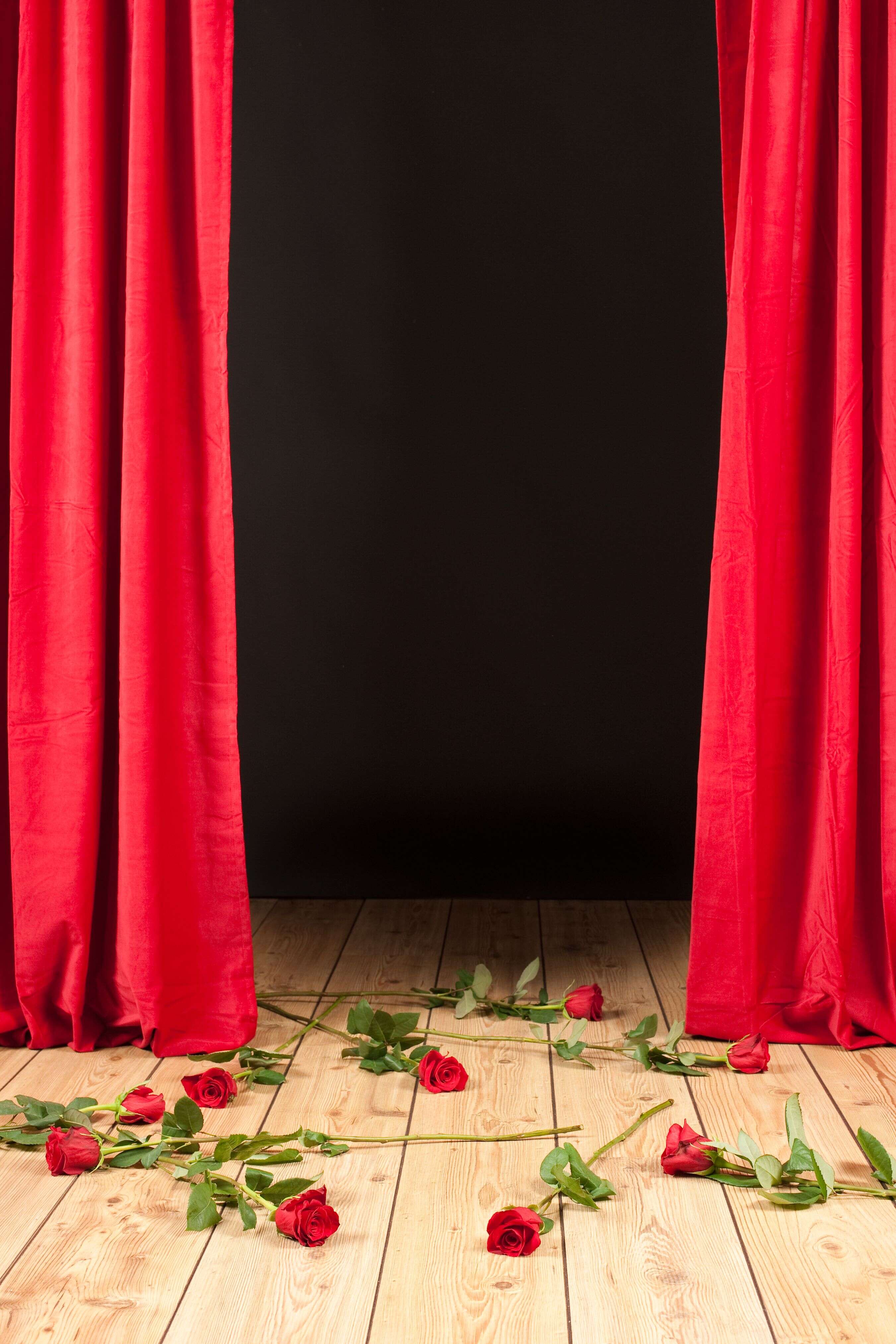 stage theater with roses on the floor