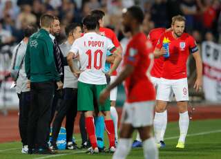 England manager Gareth Southgate, third left, speaks with Referee Ivan Bebek during the Euro 2020 group A qualifying soccer match between Bulgaria and England, at the Vasil Levski national stadium, in Sofia, Bulgaria, Monday, Oct. 14, 2019. (AP Photo/Vadim Ghirda)