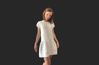 La petite robe verte de Tissuni est blanche, l'une des couleurs les moins toxiques.