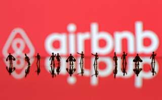 A 3D printed people's models are seen in front of a displayed Airbnb logo in this illustration taken, June 8, 2016. REUTERS/Dado Ruvic/Illustration TPX IMAGES OF THE DAY