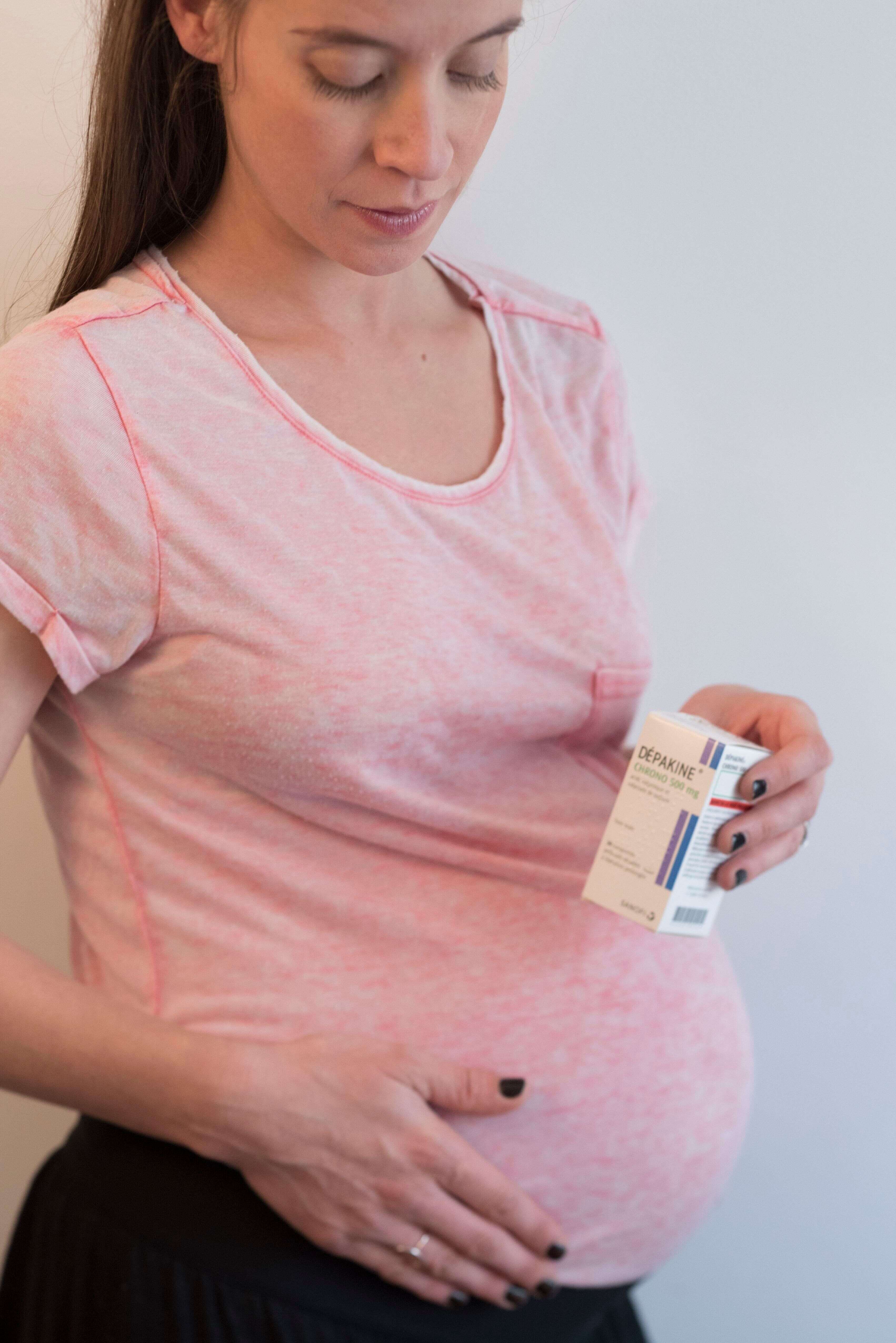 Pregnant woman holding a box of Depakine, Valproic Acid, used to treat seizures. (Photo by: BSIP/Universal Images Group via Getty Images)