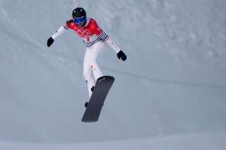 France's Chloe Trespeuch competes during the women's snowboard cross qualification round at the 2022 Winter Olympics, Wednesday, Feb. 9, 2022, in Zhangjiakou, China. (AP Photo/Aaron Favila)