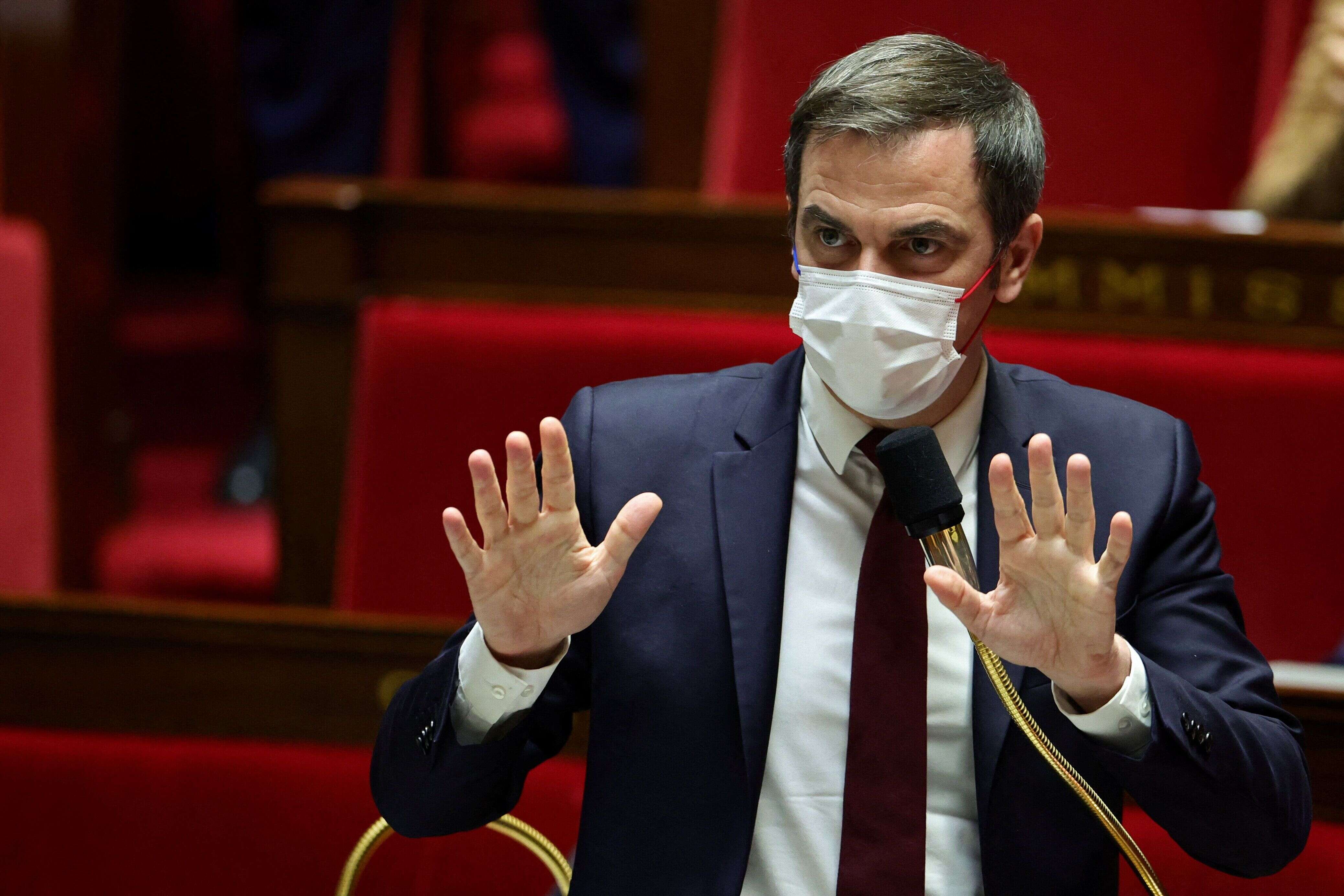 French Health Minister Olivier Veran, wearing a protective face mask, gestures during the opening debate on the French government's planned bill to transform the current health pass into a vaccine pass, at the National Assembly in Paris, France, January 3, 2022. REUTERS/Sarah Meyssonnier
