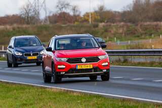 Wierden, Twente, Overijssel, Netherlands, november 23rd 2021, a Dutch  red 2018 Volkswagen 1st generation T-Roc station wagon (1.5 TSI 150pk Sport) approaching on the N36 road at Wierden - the T-Roc is a subcompact crossover SUV made by German, Wolfsburg based manufacturer Volkswagen since 2017