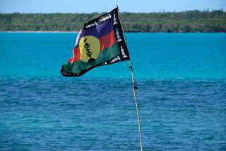 The Kanak independence flag flies over the bay of Saint-Maurice, on the southern archipelago of the French Pacific territory of New Caledonia on May 17, 2021. - The inhabitants of Ile des Pins voted 69.8% for the independence of New Caledonia in the 2020 referendum. (Photo by Theo Rouby / AFP) (Photo by THEO ROUBY/AFP via Getty Images)