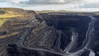 MERTHYR TYDFIL, WALES - NOVEMBER 01: An aerial view at Ffos-y-Fran opencast coalmine on November 1, 2021 in Merthyr Tydfil, Wales. The opencast coal mine, which is due to close in 2022, is one of the few remaining such mines in the United Kingdom. The UK has largely transitioned away from coal, relying more on natural gas and renewables for its power grid, and vows to stop burning coal to generate electricity by October 1, 2024. (Photo by Matthew Horwood/Getty Images)