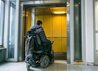 Handicapped male waiting for elevator