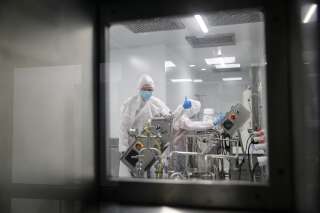 Production scientists work in a laboratory at biotech start-up, Afrigen Biologics as it gears up for the production of Africa's first COVID-19 vaccine using the mRNA platform, in Cape Town, South Africa, June 23, 2021. Picture taken June 23, 2021. REUTERS/Sumaya Hisham