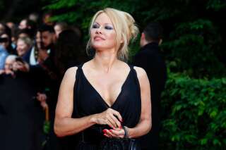 US actress Pamela Anderson arrives with Soccer player Adil Rami at the UNFP (Union of French Professional Footballers) ceremony, in Paris, France, Sunday, May 19, 2019. (AP Photo/Francois Mori)