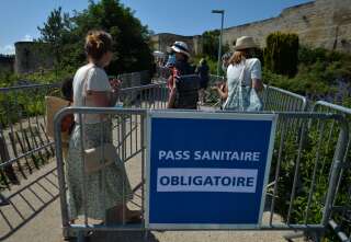 Sign 'Pass Sanitaire (Health Pass) - Compulsory' seen at the entrance to the Château de Caen. On Wednesday, July 20, 2021, in Caen, Calvados, Normandy, France. (Photo by Artur Widak/NurPhoto via Getty Images)
