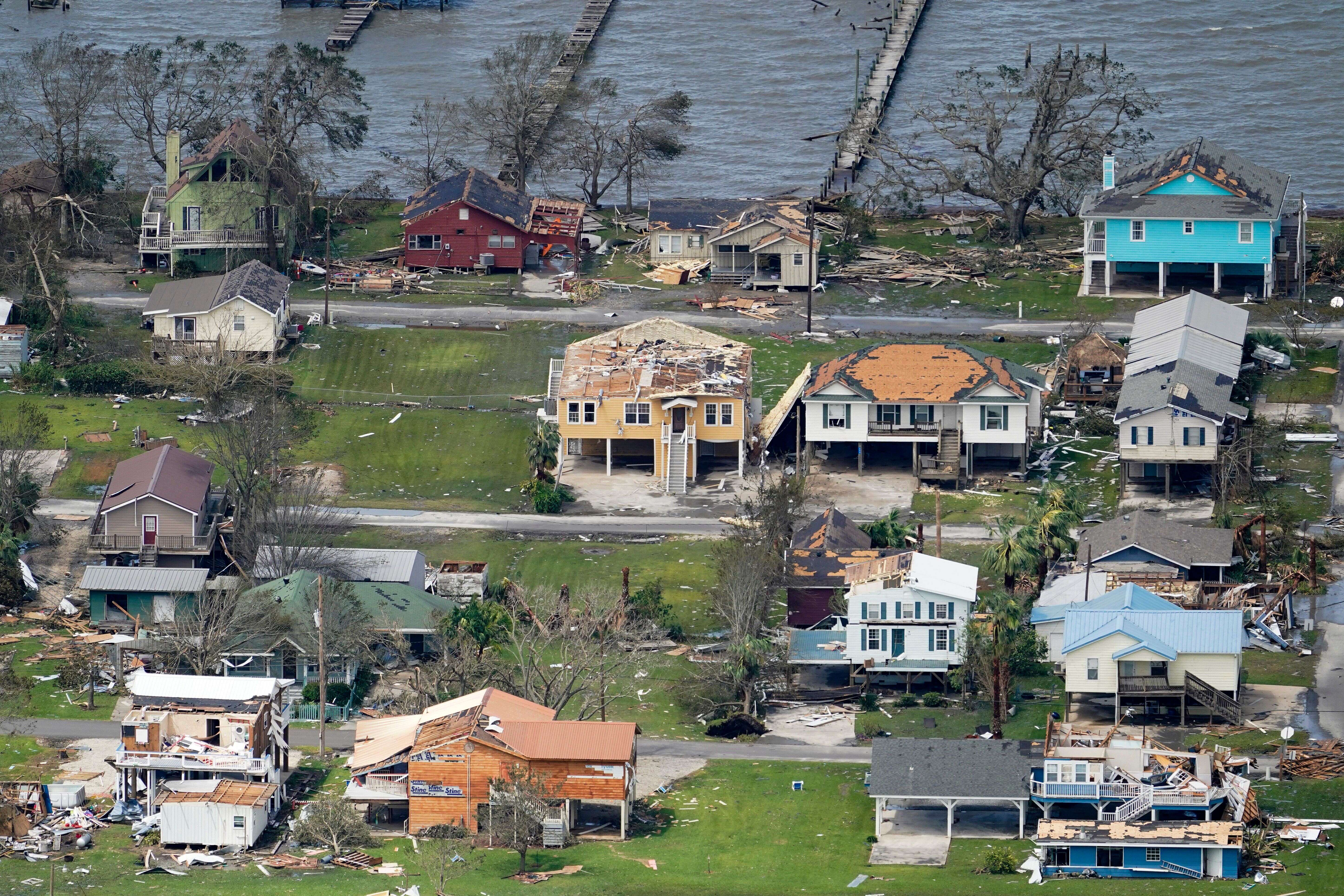 Buildings and homes are damaged in the aftermath of Hurricane Laura Thursday, Aug. 27, 2020, near Lake Charles, La. (AP Photo/David J. Phillip)