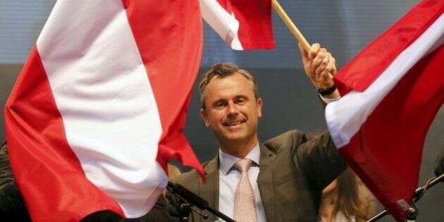 Austrian far right Freedom Party (FPOe) presidential candidate Norbert Hofer waves with Austrian flags during the final election rally in Vienna, Austria, April 22, 2016.   REUTERS/Leonhard Foeger