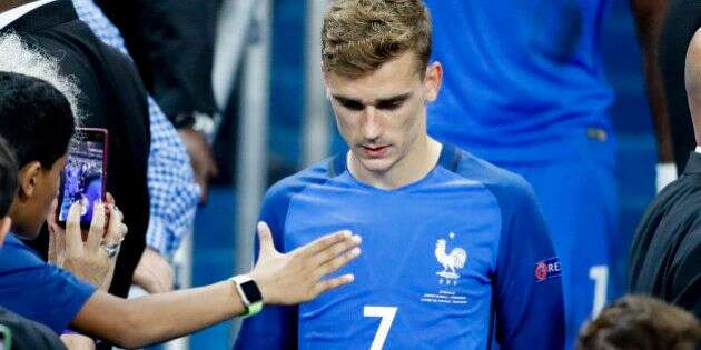 France's Antoine Griezmann walks down the tribune at the end of the Euro 2016 final soccer match between Portugal and France at the Stade de France in Saint-Denis, north of Paris, Sunday, July 10, 2016. Portugal won 1-0. (AP Photo/Frank Augstein)