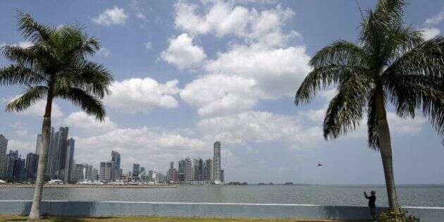A man takes pictures on the seafront of Panama City, April 4, 2016. REUTERS/Carlos Jasso