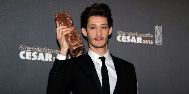 Pierre Niney poses with his Cesar of the Best Actor for a photo during the 40th French Cesar Awards Ceremony in Paris, Friday Feb. 20, 2015. This annual ceremony is presented by the French Academy of Cinema Arts and Techniques. (AP Photo/Thibault Camus)