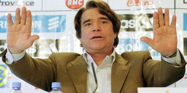 ** FILE ** Former flamboyant businessman and leftist politican Bernard Tapie is seen in Marseille during a press conference in this April 9, 2001 file photo. An appeal court in Paris on Friday, Sept. 30, 2005 ordered the French government and formerly state-owned bank Credit Lyonnais, now called Le Credit Lyonnais, or LCL, to pay 135 million (US$163 million) in compensation over the 1994 sale of sportswear maker Adidas. Credit Lyonnais, since privatized and acquired by rival bank Credit Agricole SA, and the CDR government agency set up to take over its bad debts, were ordered to pay the compensation to Bernard Tapie, Adidas' former owner. (AP Photo/Claude Paris, file)