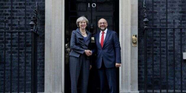 British Prime Minister Theresa May and the President of the European Parliament Martin Schulz perform a posed handshake for the media before their talks at 10 Downing Street in London, Thursday, Sept. 22, 2016. (AP Photo/Matt Dunham)