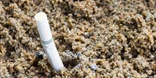 sand ashtray  with cigarette ...
