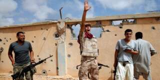 A member of Libyan forces allied with the U.N.-backed government gestures during a battle with Islamic State fighters in Sirte, Libya, July 15, 2016. REUTERS/Goran Tomasevic