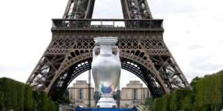 A 12-metre high replica of the Henri Delaunay Trophy is seen ahead of this week's brand and logo presentation of the UEFA EURO 2016, near the Eiffel Tower in Paris June 24, 2013. France will host the EURO 2016 where twenty-four teams are to compete in ten cities from June 10, 2016 through July 10, 2016.  REUTERS/Charles Platiau   (FRANCE - Tags: SPORT SOCCER)
