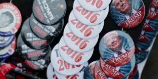 Snow collects on buttons for sale outside a campaign event for Republican presidential candidate Donald Trump at the Londonderry Lions Club Monday, Feb. 8, 2016, in Londonderry, N.H. (AP Photo/David Goldman)