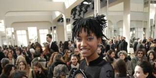 Willow Smith poses before Chanel's Fall-Winter 2016-2017 ready to wear fashion collection presented in Paris, Tuesday, March 8, 2016. Sitting at left is her mother Jada Pinkett Smith. (AP Photo/Thibault Camus)