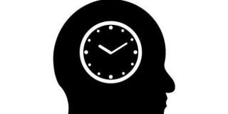 time symbol in a man's head...