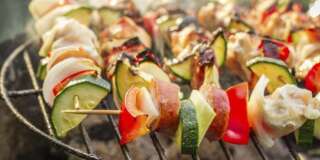 Hot skewers on the grill with fire.