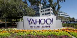 Flowers bloom in front of a Yahoo sign at the company's headquarters Tuesday, July 19, 2016, in Sunnyvale, Calif. (AP Photo/Marcio Jose Sanchez)