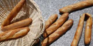 Broken loaves litter the finish area after a lighthearted French baguette relay race as part of a Bastille Day promotion at the La maison Paul restaurant in Washington, July 14, 2013. The restaurant says the bread in their Washington restaurants comes from a