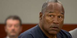 O.J. Simpson listens as his defense attorney, Ozzie Fumo (not shown), questions witness David Cook (also not shown) during an evidentiary hearing in Clark County District Court in Las Vegas, Nevada May 16, 2013. O.J. Simpson, the former football star famously acquitted of murder in 1995, took the witness stand in a Las Vegas courtroom on Wednesday seeking a new trial in an armed-robbery case that sent him to prison five years ago.    REUTERS/Julie Jacobson/Pool  (UNITED STATES  - Tags: CRIME LAW ENTERTAINMENT SPORT)