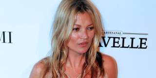 British model Kate Moss poses on the red carpet at a Foundation for AIDS Research (amfAR) event in Sao Paulo, Brazil, Friday, April 10, 2015. (AP Photo/Andre Penner)