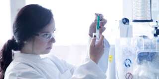 Young female scientist working in a biochemistry labroratory