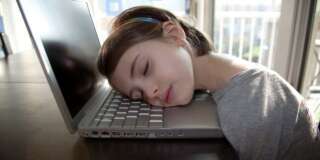 Young girl (5 years old) sleeping on laptop computer