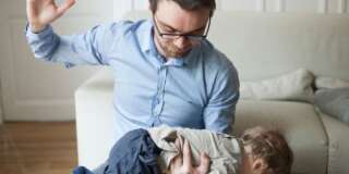 Father disciplining toddler
