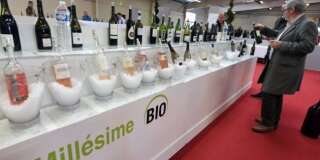 People visit a stand of the 'Millesime Bio 2016', an international organic wine fair, on January 26, 2016 in Montpellier. The event aims at promoting wines made from organically grown grapes and features new vintages for buyers. / AFP / PASCAL GUYOT        (Photo credit should read PASCAL GUYOT/AFP/Getty Images)