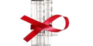 Syringes with aids awareness symbol