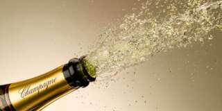 Champagne exploding from bottle