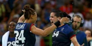 2016 Rio Olympics - Handball - Semifinal - Women's Semifinal Netherlands v France - Future Arena - Rio de Janeiro, Brazil - 18/08/2016. Beatrice Edwige (FRA) of France and Alexandra Lacrabere (FRA) of France celebrate after the match. REUTERS/Alkis Konstantinidis FOR EDITORIAL USE ONLY. NOT FOR SALE FOR MARKETING OR ADVERTISING CAMPAIGNS.