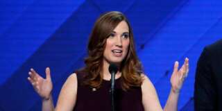 LGBT rights activist Sarah McBride speaks as Rep. Sean Patrick Maloney, D-NY, Co-Chair of the Congressional LGBT Equality Caucus listens during the final day of the Democratic National Convention in Philadelphia , Thursday, July 28, 2016. (AP Photo/J. Scott Applewhite)