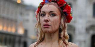Inna Shevchenko, a member of the Ukrainian feminist protest group FEMEN, stages a protest in front of the Duomo gothic cathedral in Milan, Italy, Thursday, Oct. 16, 2014. The 10th Asia-Europe Meeting (ASEM) will take place in Milan, Italy on Thursday 16 and Friday 17 October, 2014, under the theme