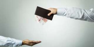 Businessman's hand holding wallet