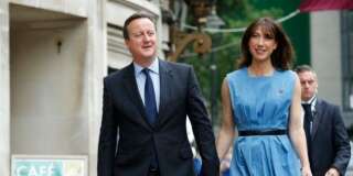 Britain's Prime Minister David Cameron and his wife Samantha arrive to vote in the EU referendum in London, Thursday June 23, 2016. Polls opened in Britain Thursday for a referendum on whether the country should quit the European Union bloc of which it has been a member for 43 years. (AP Photo/Alastair Grant)