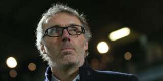Paris Saint Germain's head coach Laurent Blanc reacts at the start of his French League One soccer match against Angers, Tuesday, Dec. 1, 2015, in Angers, western France. (AP Photo/David Vincent)