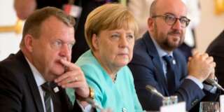 German Chancellor Angela Merkel, center, listens to the opening remarks at an EU summit at Bratislava Castle in Bratislava on Friday, Sept. 16, 2016. An EU summit, without the participation of the United Kingdom, in Bratislava will kick off the discussion on the future of the EU following Brexit. At left is Danish Prime Minister Lars Lokke Rasmussen and right is Belgian Prime Minister Charles Michel. (AP Photo/Virginia Mayo)
