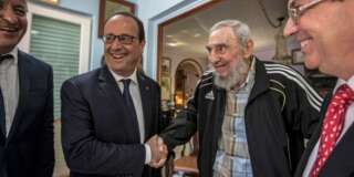 Cuba's former leader Fidel Castro, second right, shakes hands with French President Francois Hollande, while accompanied by Cuba's Foreign Minister Bruno Rodriguez, right, and an unidentified person, left, in Havana, Cuba, Monday, May 11, 2015. Hollande is the first French leader to visit the island nation in more than a century and also the first Western leader to travel to Cuba since the surprise announcement in December of a rapprochement between Washington and Havana. (AP Photo/Alex Castro)